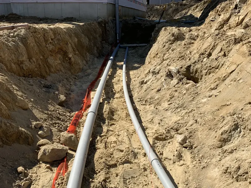 Underground 200-amp service entrance conduit trench running from the utility to a new construction home in Southern NH by A.J. LeBlanc Heating