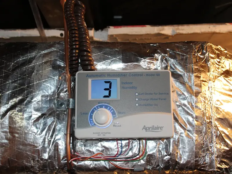Aprilaire Automatic Humidifier Control Model 60 mounted on insulated supply ductwork by A.J. LeBlanc Heating in Southern NH