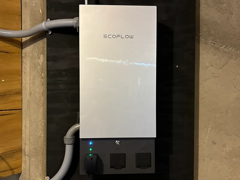 Wall-mounted whole-home battery backup with automatic transfer switch and critical-load panel installed by A.J. LeBlanc Heating in Southern NH