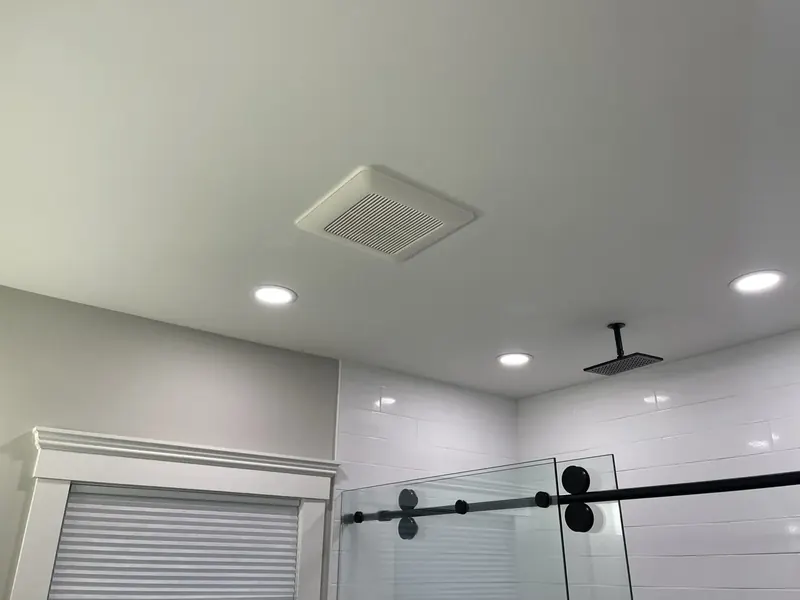 Bathroom recessed LED lighting and ceiling exhaust fan installation by A.J. LeBlanc Heating in Southern NH