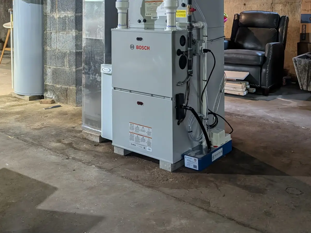 Bosch 96% AFUE condensing propane furnace with sealed-combustion venting in a Southern NH basement