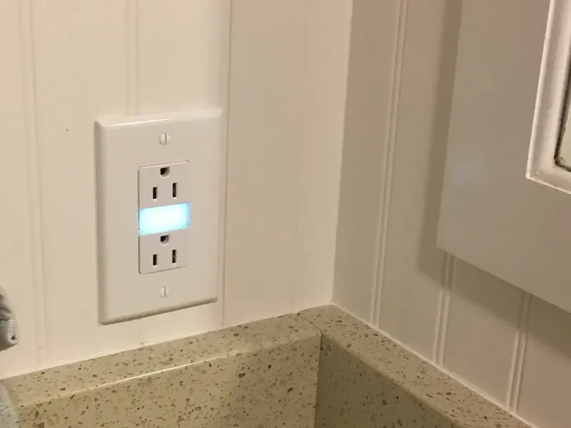 Leviton Decora duplex outlet with built-in LED nightlight installed by A.J. LeBlanc Heating in a Southern NH home