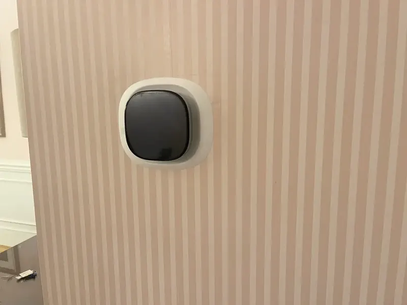 Ecobee Premium smart thermostat installed with a trim plate over patched wallpaper by A.J. LeBlanc Heating in a Southern NH home