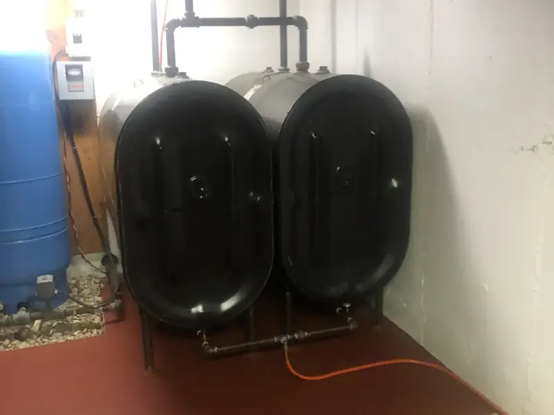 Granby twin oil tank installation by A.J. LeBlanc Heating in a Southern NH basement