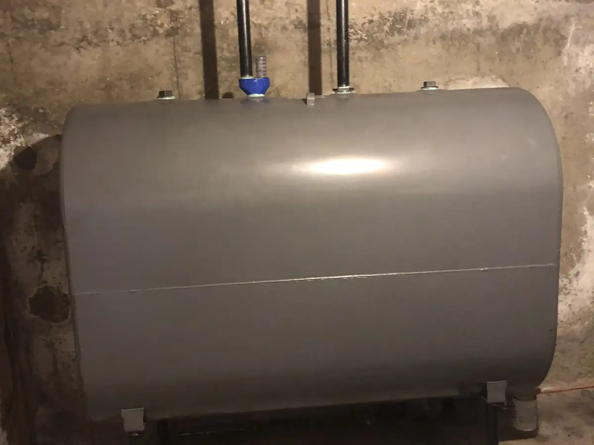 Standard 275 gallon oil tank being abandoned and removed by A.J. LeBlanc Heating in a Southern NH basement