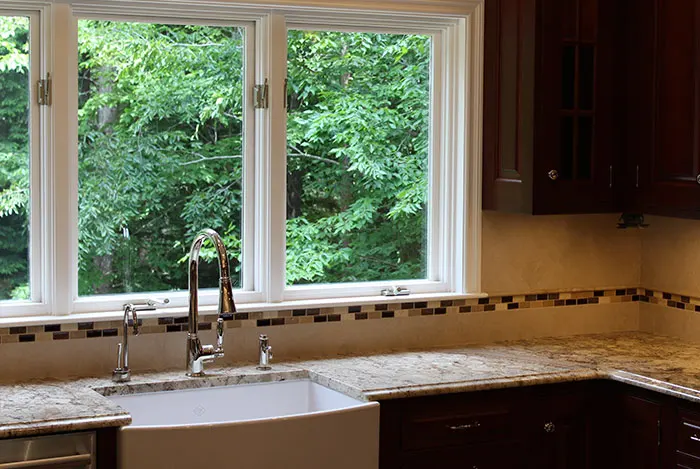 kitchen sink plumbing installation with farmhouse style sink