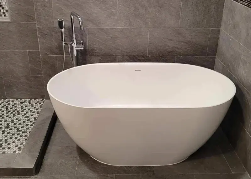 Modern freestanding bathtub installed by A.J. LeBlanc Heating in a Southern NH home