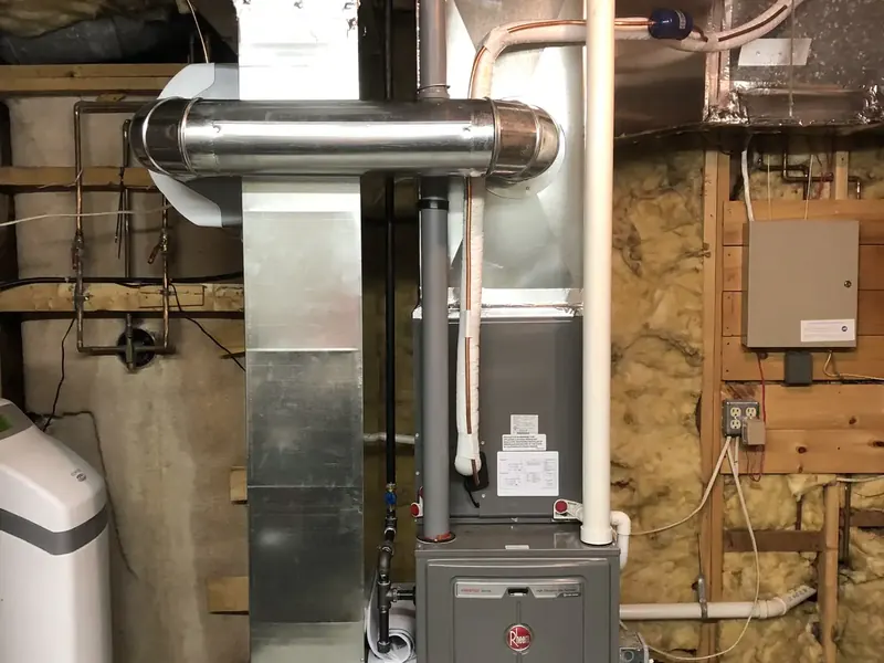 Rheem furnace installation with whole-home humidifier integrated into the supply ductwork by A.J. LeBlanc Heating in Southern NH