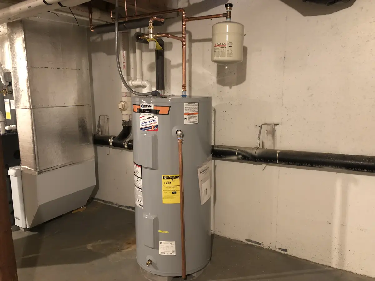 A.J. LeBlanc Heating State ProLine electric tank water heater installation with copper plumbing and Amtrol expansion tank in a Southern NH basement