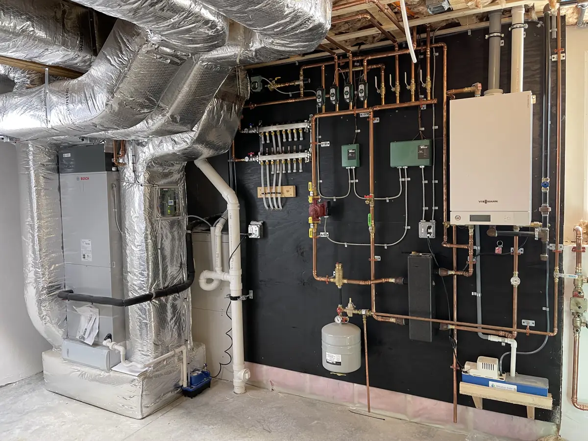 Viessmann wall-hung boiler paired with Bosch hydro-air handler and heat pump in Southern NH