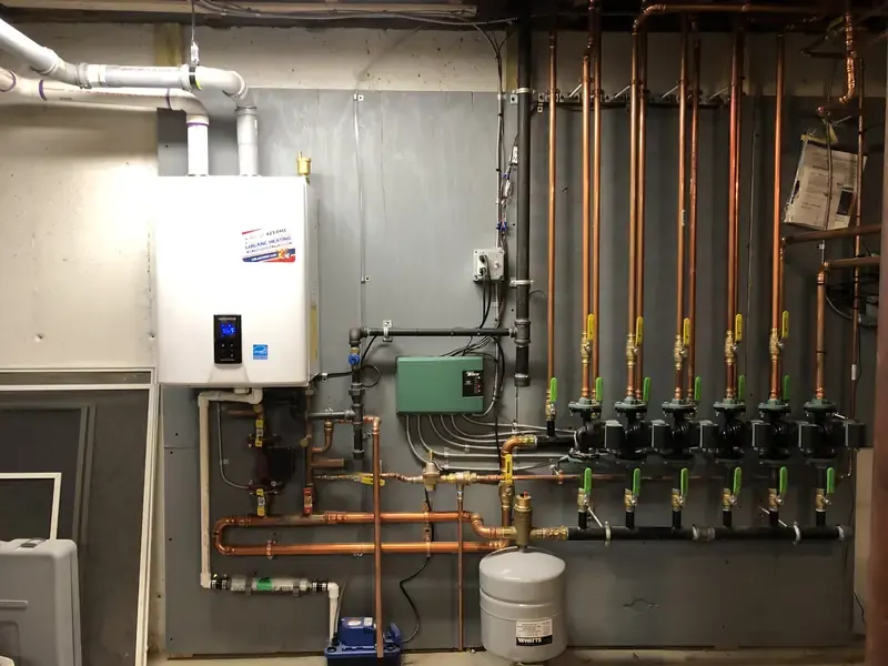 Wall-hung condensing boiler with multi-zone copper hydronic manifold, Southern NH